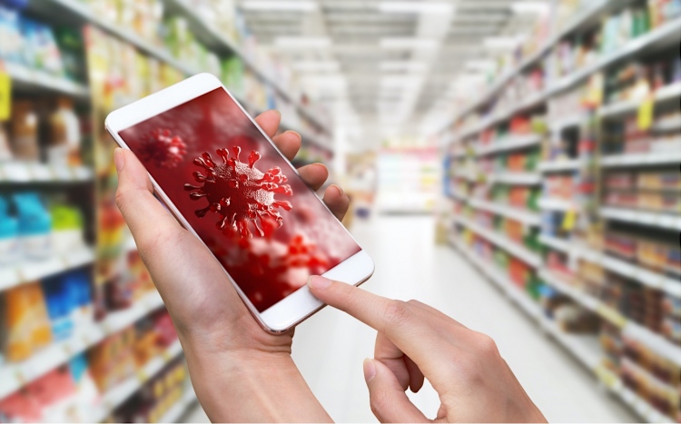 Smartphone con fondo de pantalla 3D Coronavirus o Covid-19 en una supermercado.