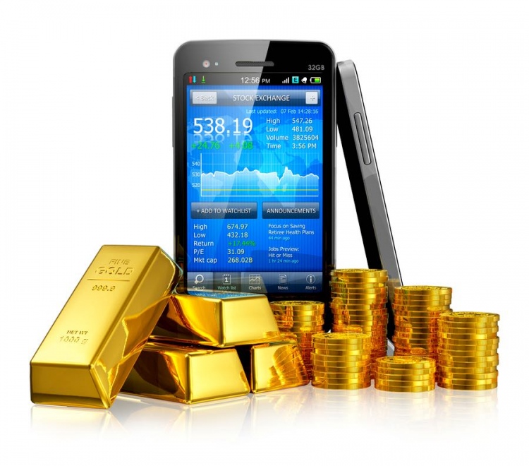 Teléfono inteligente con aplicación del mercado de valores, lingotes de oro y monedas de oro.